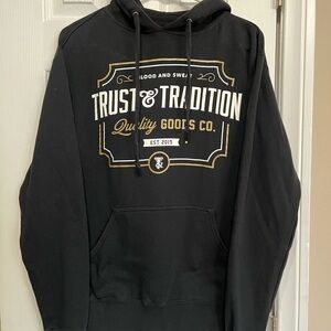 Trust & Tradition Black Graphic Hoodie with Gold and White Print size S